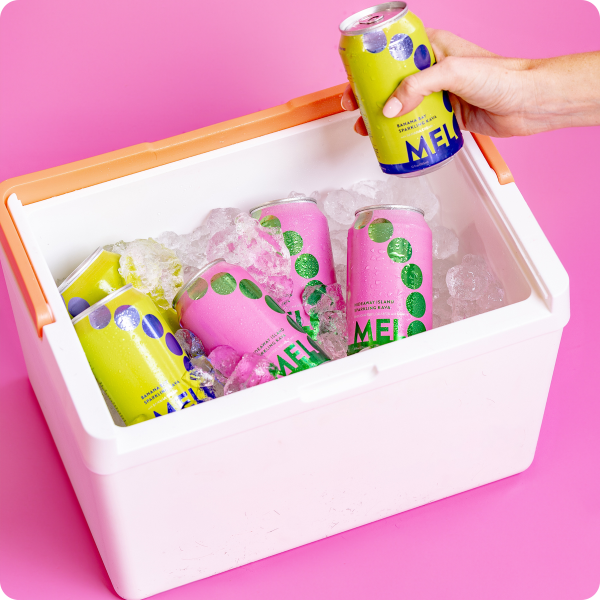 Melo sparkling kava cans in an ice-filled cooler, with a hand reaching for a can.