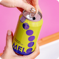 a hand opening a can of melo