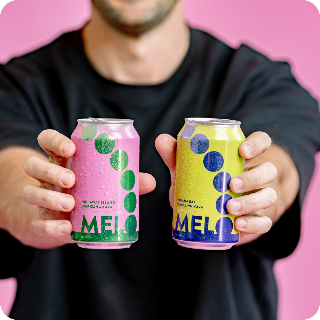 Man holding Melo sparkling kava drink cans, showcasing Passionfruit Orange Guava and Banana Cream flavors